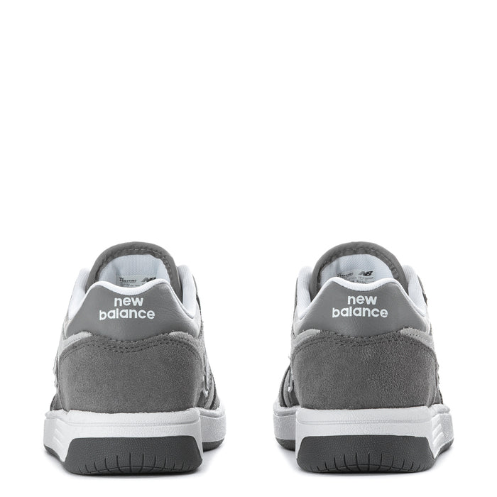 Kids' wide sneakers heel view in gray suede with New Balance branding on back