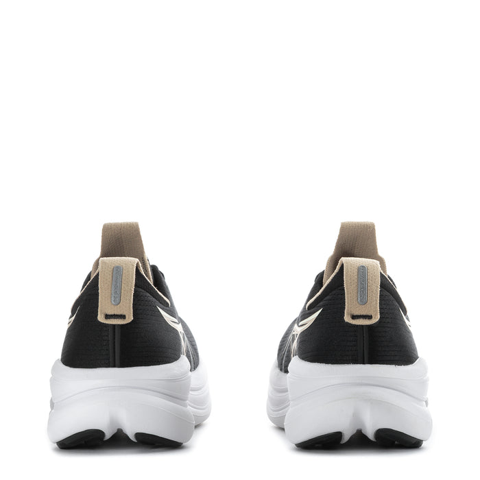 Women’s black running shoes with beige heel pull tabs and white cushioned soles