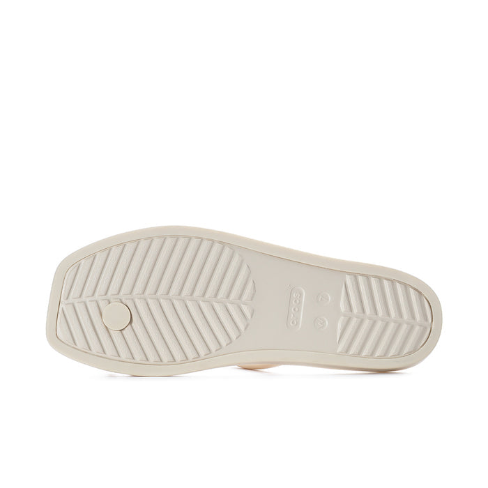Underside of women’s light toe-loop sandals with textured tread outsole