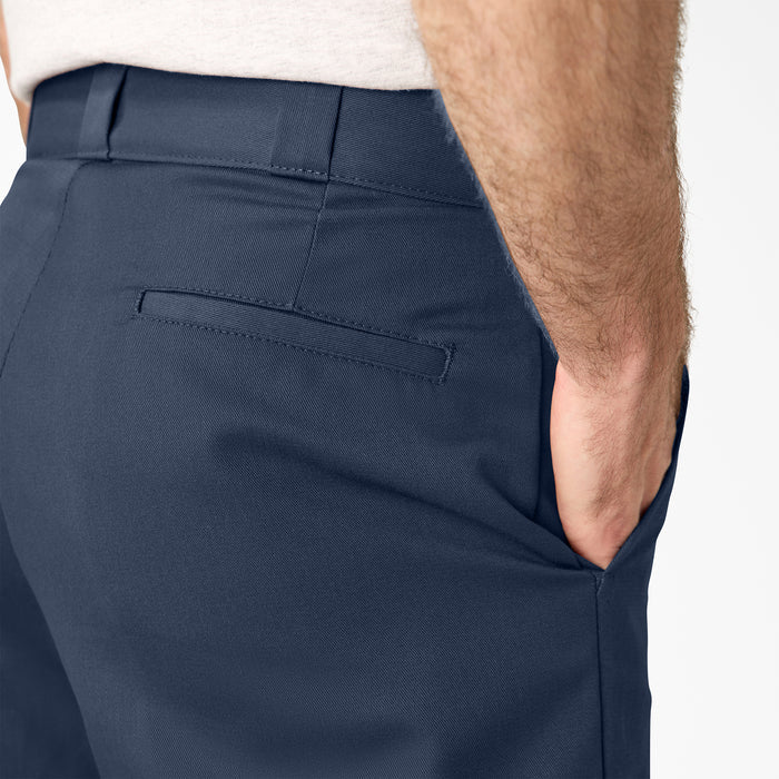 Men's dark navy shorts fabric close-up with back pocket seam and stitching
