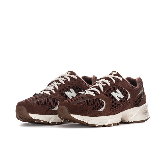 Women’s dark brown mesh running sneaker, white laces, large N logo, thick white sole.