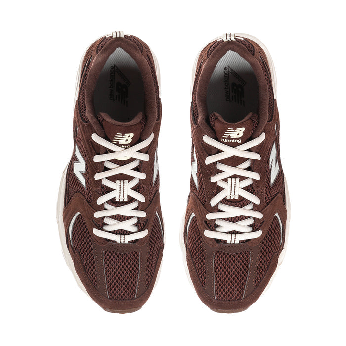 Women’s dark brown sneaker with white lace-up, N on tongue, and side mesh panels.