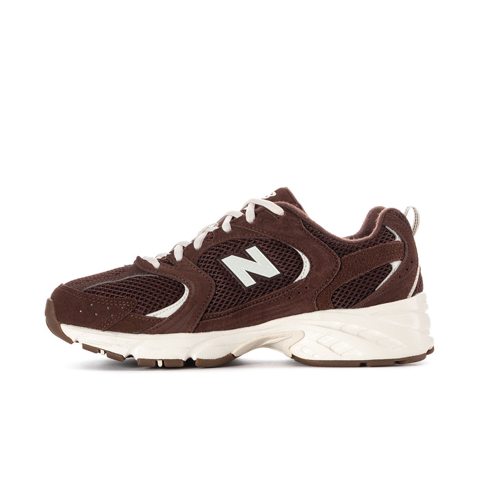 Women’s dark brown running sneaker with N logo, white laces, and textured white sole.