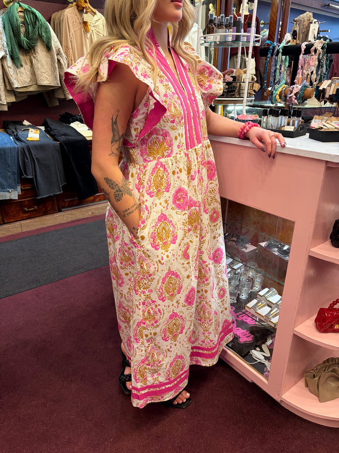 Pink ruffle sleeve maxi dress with exotic damask pattern by Entro, featuring flowing fabric and elegant design.