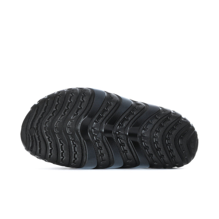 Men's black slide sandal outsole with deep tread pattern and textured sidewall