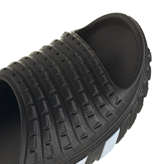 Close-up of men's black slide sandal upper with embossed texture and open toe