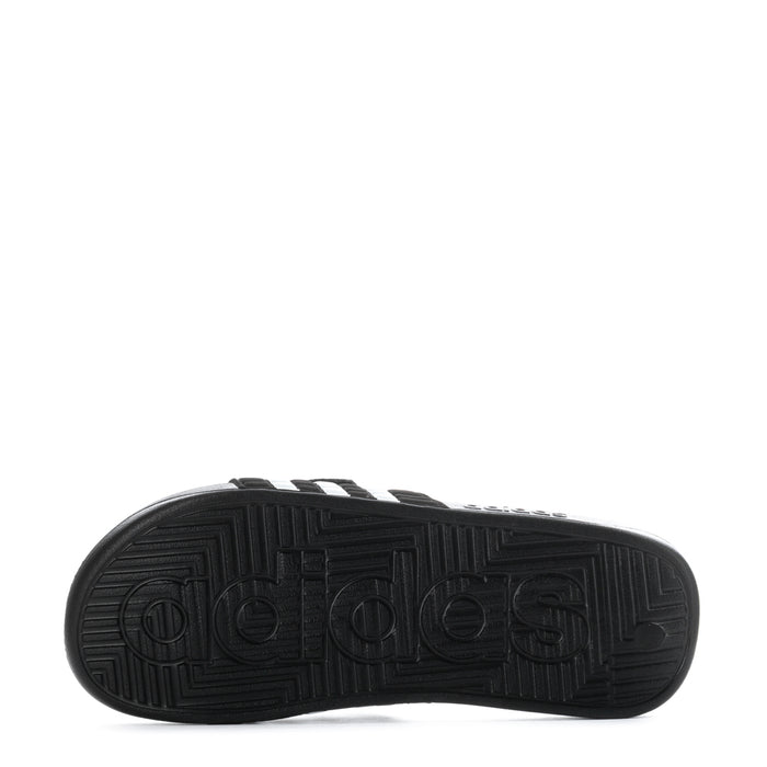 Men's black adidas slide sandal outsole tread with textured traction pattern