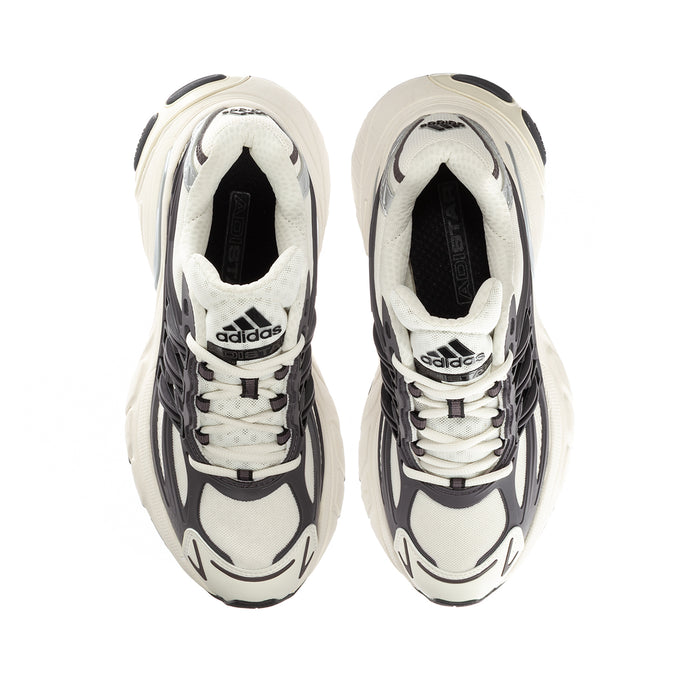 Youth adidas sneakers front view with lace-up system and padded interior lining.