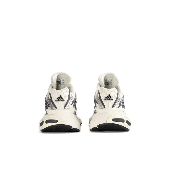 Youth adidas sneakers rear view with cream uppers and black heel accents.