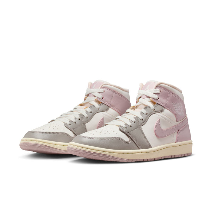 Womens mid-top sneakers in white and lavender with lace-up front and low-profile sole