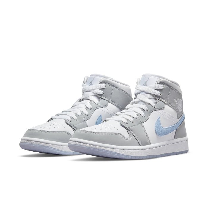 Mid-top sneakers in white, light gray, with light blue swoosh and wing details