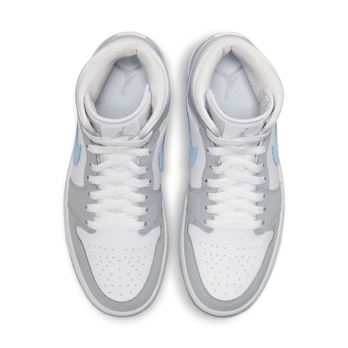 Pair of mid-top sneakers showing white laces and light gray toe box with blue swooshes