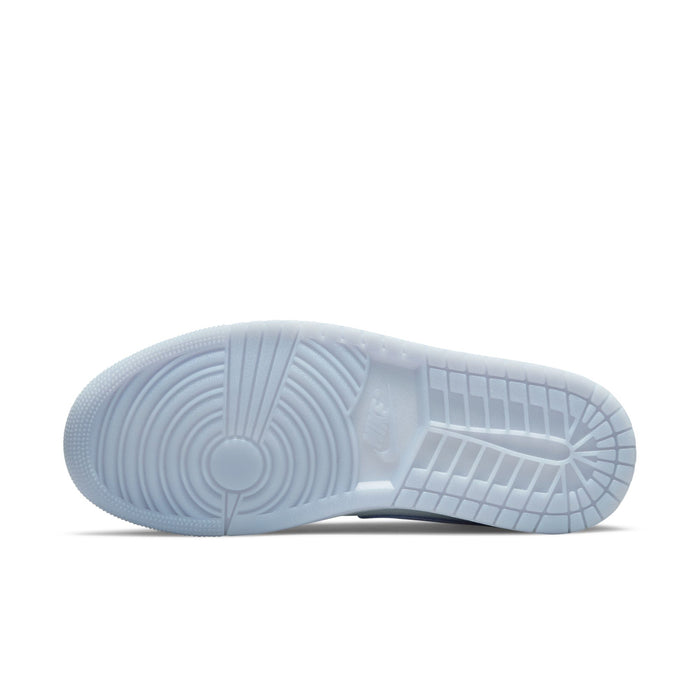 Outsole of light blue-gray mid-top sneakers with textured traction pattern