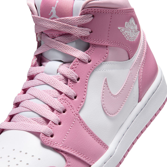 Women’s Air Jordan 1 Mid sneakers detail, pink laces, white Swoosh, and padded tongue