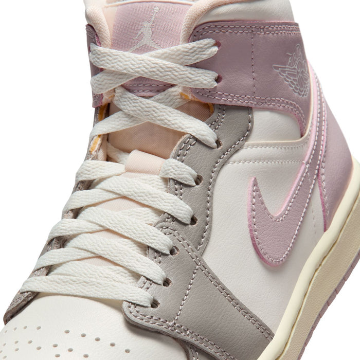 Womens mid-top sneakers close-up on laces and Nike swoosh in white and lavender