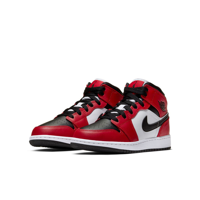 Youth mid-top sneakers, red leather upper with black laces, white panel, and Nike swoosh