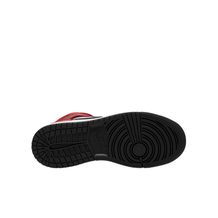 Youth mid-top sneakers outsole view with textured black rubber tread