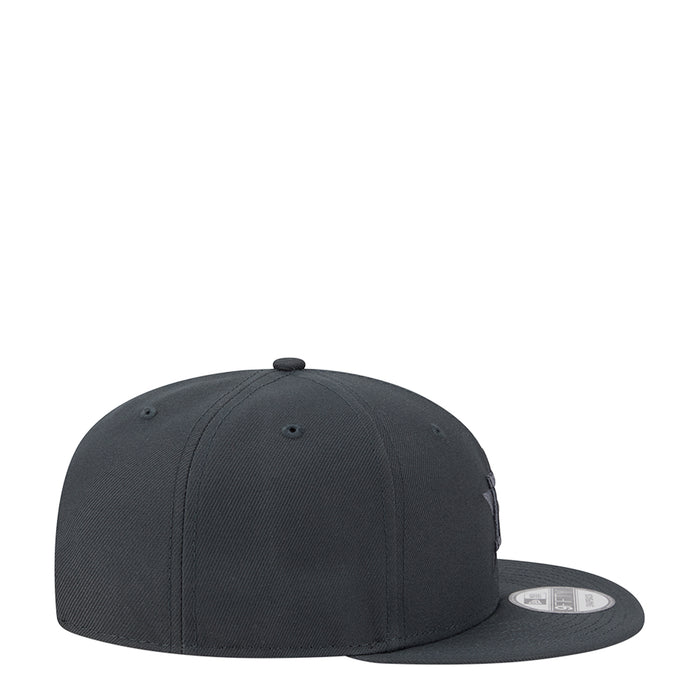 Dark gray baseball cap, side view with small stitched logo and curved brim