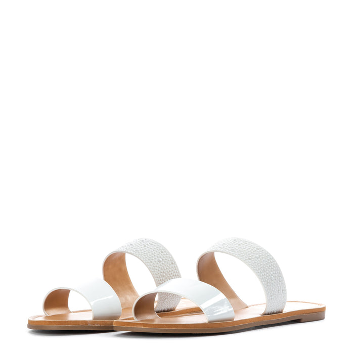Women’s white slide sandals with two wide straps and cushioned footbed