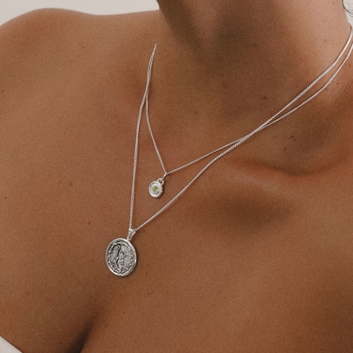 Delicate sterling silver birthstone charm layered with St Joachim silver necklace