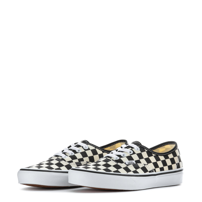 Pair of youth checkerboard canvas lace-up sneakers, black and white, front view
