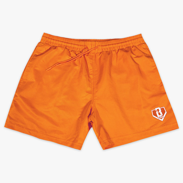 Orange shorts with a BL101 logo on a white background