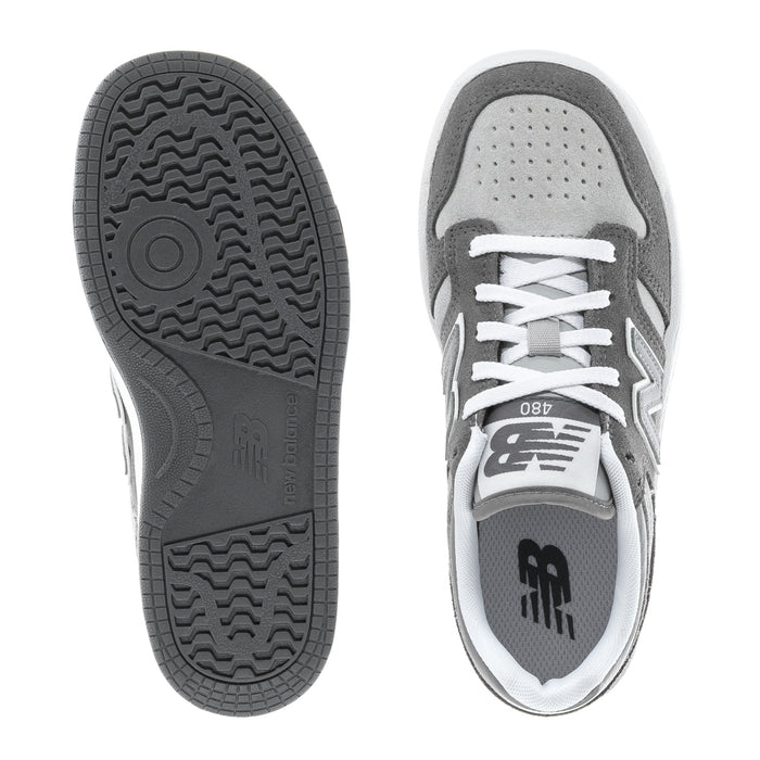 Kids' wide sneaker outsole and heel view with gray traction sole and white trim