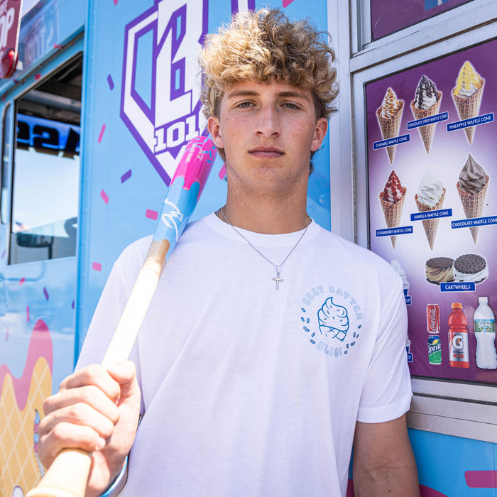 Adult model wearing white graphic tee with “Best Batter” design
