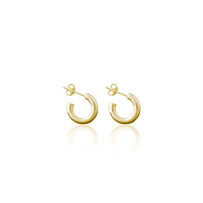 A pair of small gold hoop earrings with post backs against a white background.