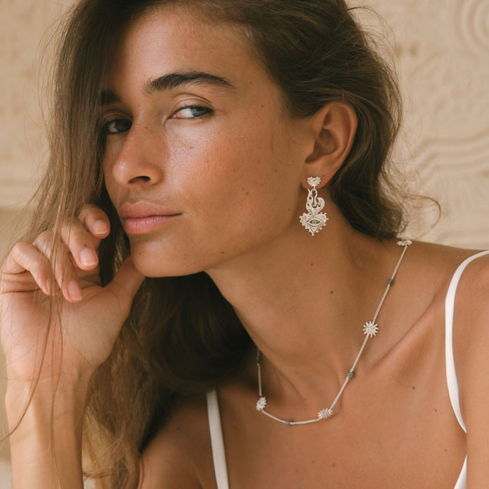 Side view Luna & Rose x Tahnee Kelland ‘Burn It All Down’ silver flaming heart statement earrings, ethically made in Bali from recycled sterling silver.