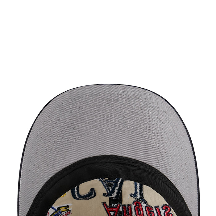 Grey baseball cap fabric close-up with black inner band and stitched seam