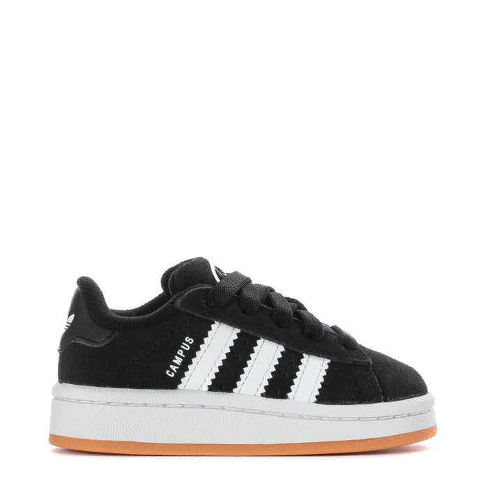 Toddler black suede sneakers with white adidas-style stripes and gum rubber sole