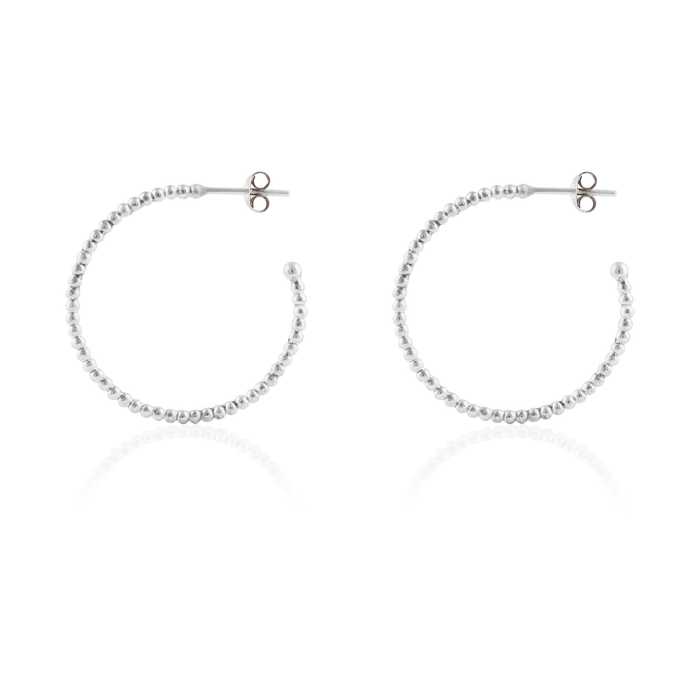 Thin silver beaded earrings angles from side, shown against a white background.