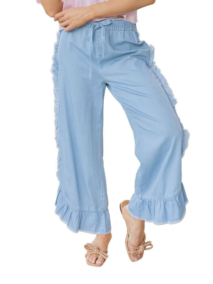 Light blue chambray ruffle pants by Simply Southern featuring a relaxed fit and ruffled hem detail.