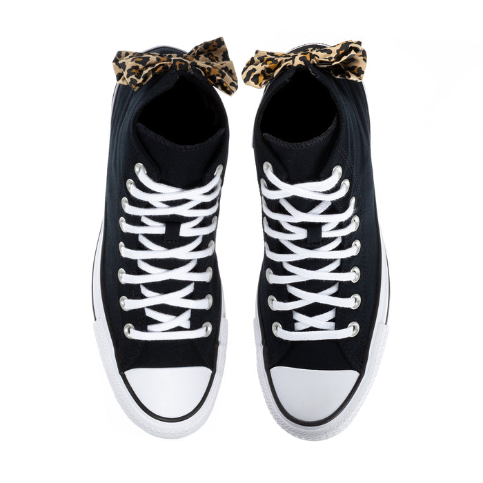 Black high-top sneakers with white laces and leopard bow at the tongue