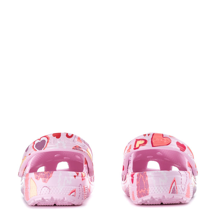 Youth pink clog heel view with transparent back and heart-pattern upper