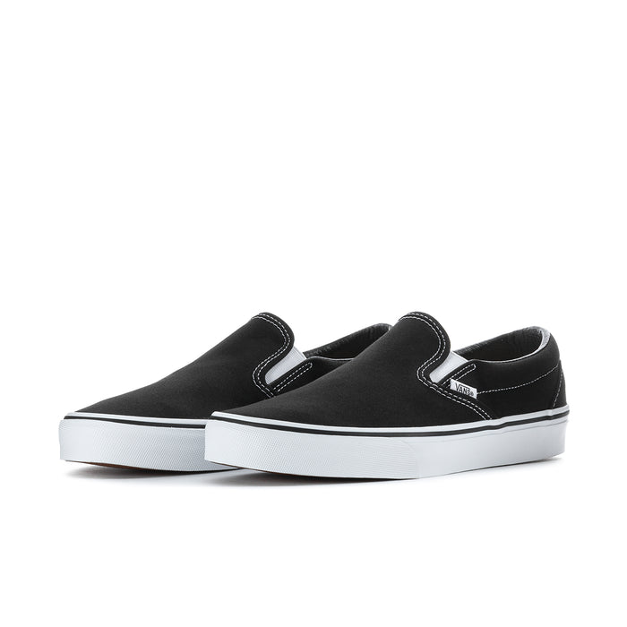 Black slip-on sneakers with white stitching, padded collar, and side stripe accents