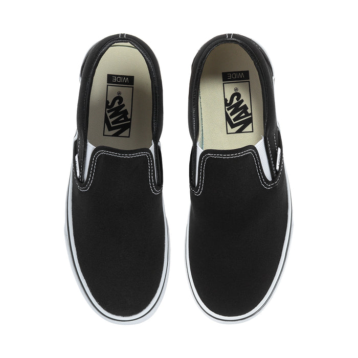 Pair of black slip-on sneakers with white soles and V logo on the side