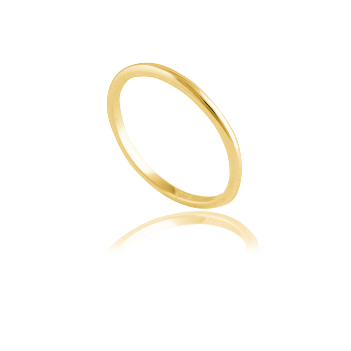 A slim gold ring angled slightly, displayed against a white background.