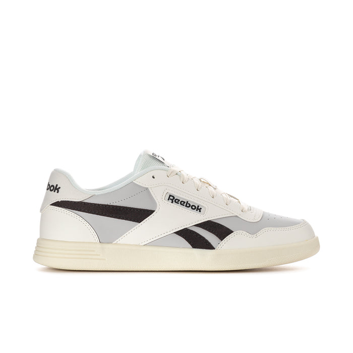 Men's white sneakers with black side stripes, light blue collar, and cream sole