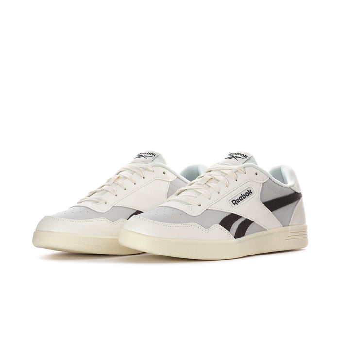 Pair of men's white sneakers with black stripes, light blue lining, and cream outsole