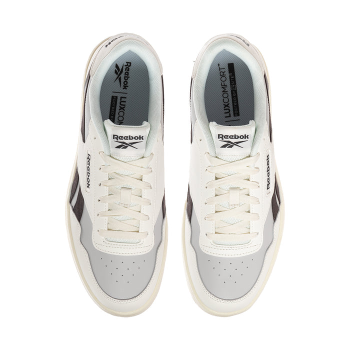 Men's white sneakers with padded light-blue collar and Reebok branding on tongue