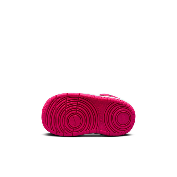 Toddler sneaker outsole in bright pink with circular traction pattern
