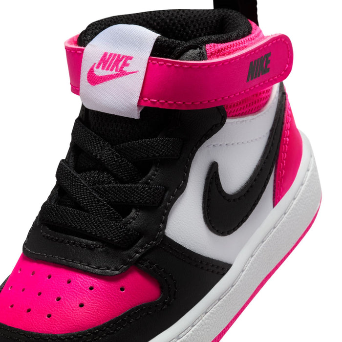 Toddler mid-top sneaker detail with Nike logo, laces, and white/black/pink panels
