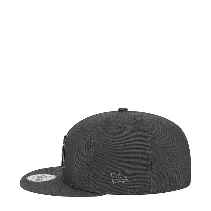 Dark gray baseball cap with small tonal logo near side panel