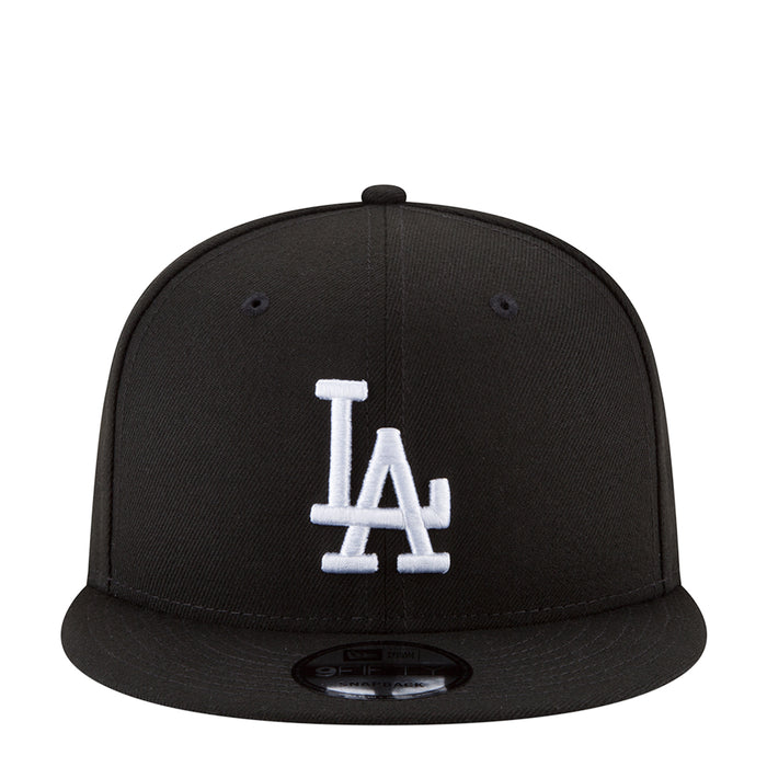 Black baseball cap with white LA logo on front and curved brim