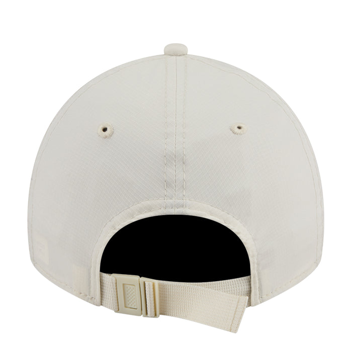 Cream strapback cap back view with black interior and adjustable buckle strap