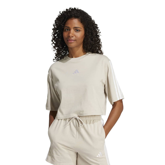 Women’s light cream loose t-shirt with gathered waist hem and small adidas logo