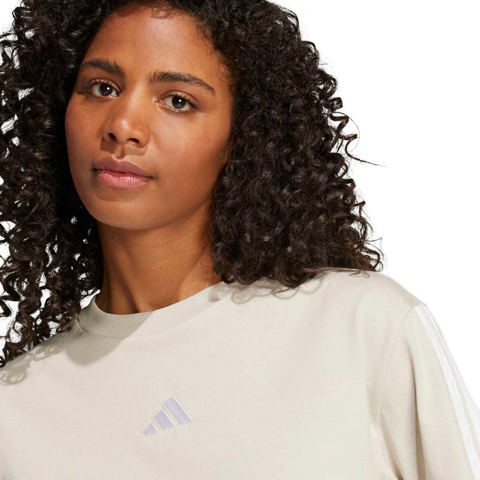 Light cream women’s t-shirt with small adidas logo on chest and crew neckline