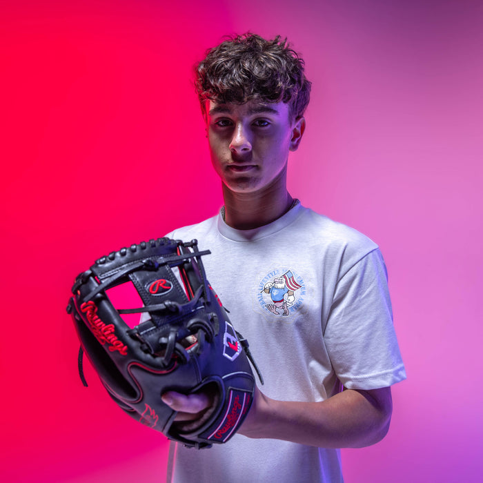 Adult model wearing graphic tee with “Fastballs & Freedom” design